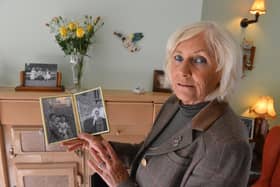 Christine Tindle, 68, with a photograph of her as a child with her mother, Jean Altoft.