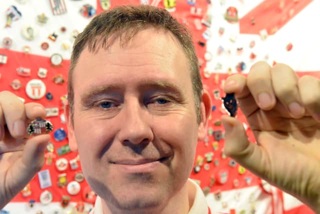 Stuart Arthur with some of the SAFC badges in the collection.