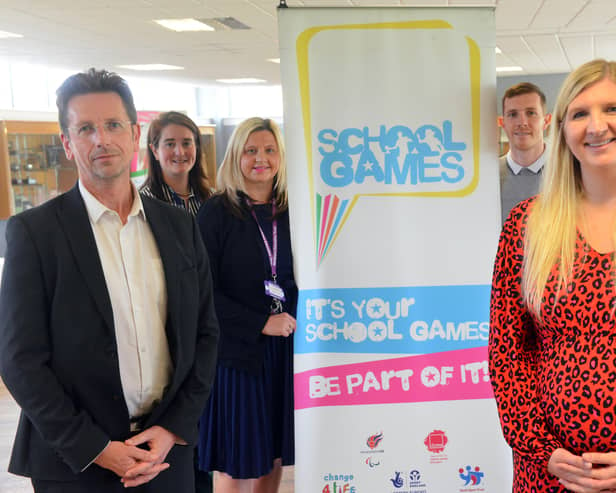 Double Olympic gold medallist Rebecca Adlington alongside Dame Dorothy Primary School headteacher Iain Williamson. 