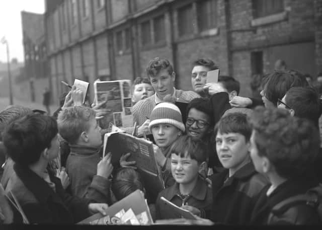 Jimmy signing autographs for his young fans in 1964.