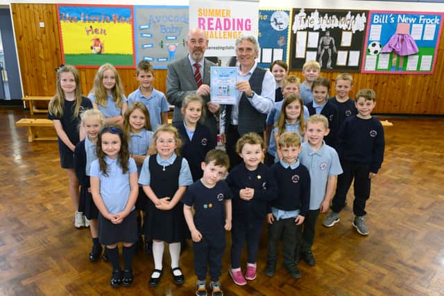 Author Richard O'Neill joined Cllr John Price to present children at St John Boste Primary School with the Summer Reading Challenge 2023 School Achievement Certificate.