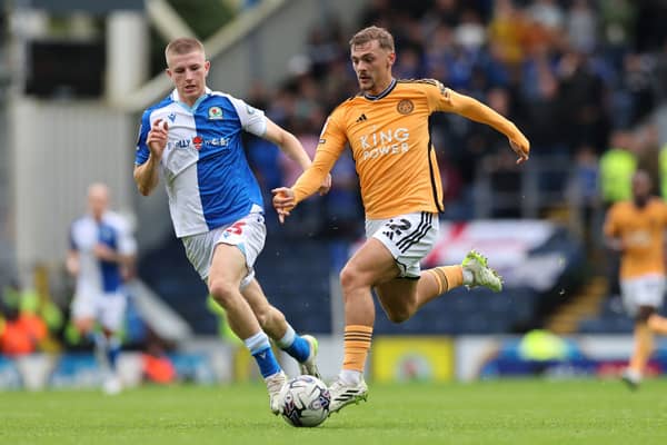 Blackburn Rovers midfielder Adam Wharton alongside Leicester City's Kiernan Dewsbury-Hall