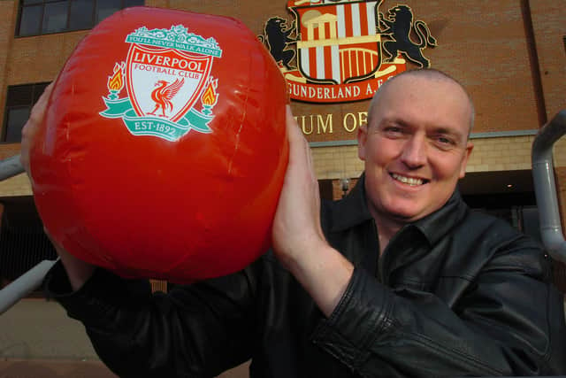 Kevin Barlow with the ball that he won in an auction.