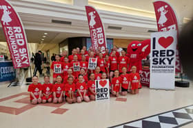 Dancers with Red Sky Foundation mascot Miss Beats