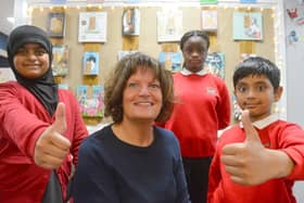 Pupils Royal Orji, Hifza Hussain and Zakwan Shahid join head teacher Claire McKinney in giving a thumbs up to their latest good Ofsted report.