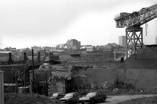 Old shipyard buildings being demolished in 1984.