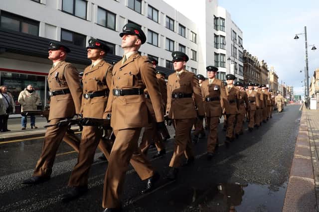 The regiment parades through the city centre