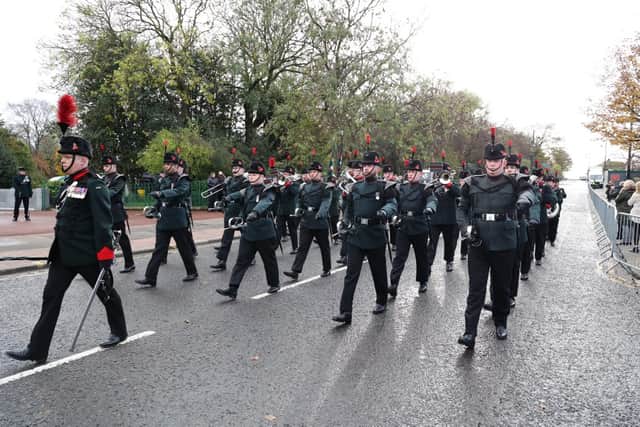 The rifles band leads the parade