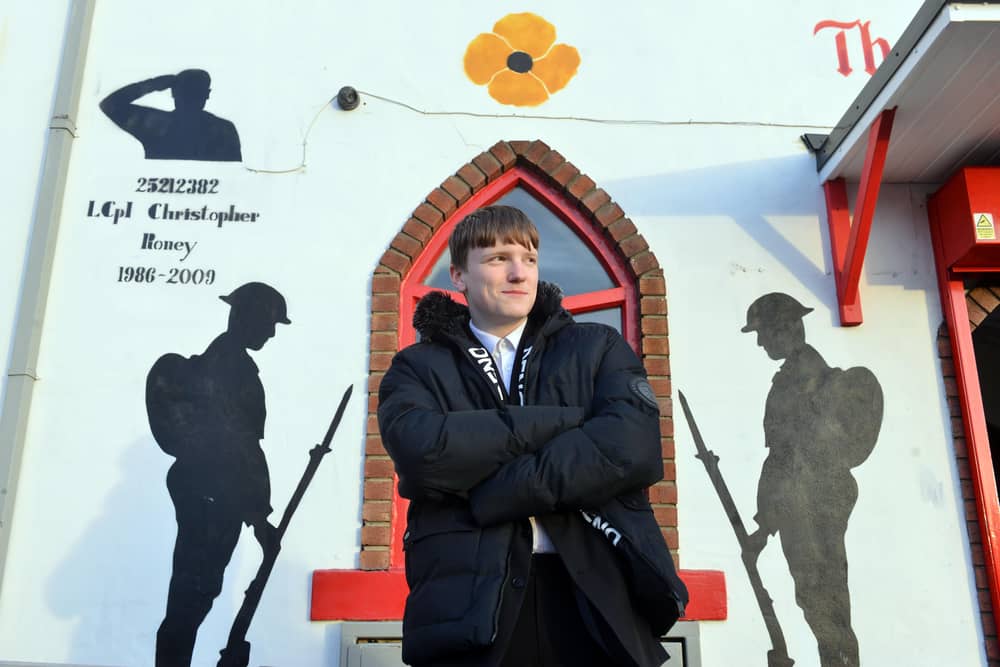 William Roney, 14, after seeing the mural tribute to his father, Chris Roney, for the first time. 