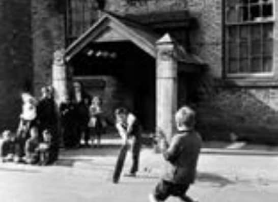A game of street cricket in West Wear Street.