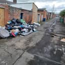 Fly-tipped waste left positioned against the rear of an address in Tower Street. Picture issued by Sunderland City Council.