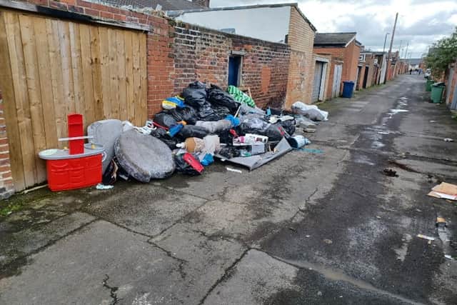 Fly-tipped waste left positioned against the rear of an address in Tower Street. Picture issued by Sunderland City Council.