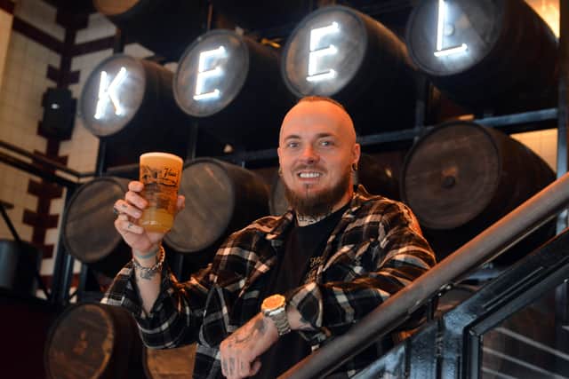 Keel Tavern assistant manager James Adams raising a glass to opening day