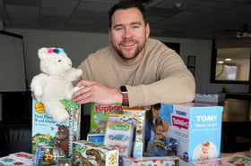 David Riley with some of the items in the toy boxes.