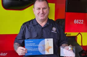Tommy with his award. Picture c/o TWFRS.