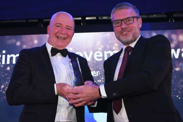 Gary Graham (left) receives his Lifetime Achievement award from Richard Hyde, Head of Business for Wearside Audi.