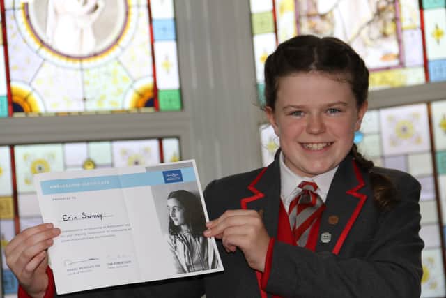 Anne Frank ambassador Erin Sweeney was presented with a certificate in a assembly at Christ's College.