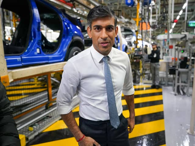Prime Minister Rishi Sunak speaks to media after he tours the car manufacturer Nissan on November 24, 2023 in Sunderland, England. The Prime Minister and Chancellor visit the Japanese car manufacturer as they announce they will be building three new electric car models at its plant in Sunderland as part of a Â£2bn investment.  (Photo by Ian Forsyth/Getty Images)
