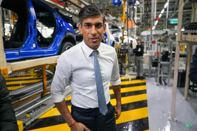 Prime Minister Rishi Sunak speaks to media after he tours the car manufacturer Nissan on November 24, 2023 in Sunderland, England. The Prime Minister and Chancellor visit the Japanese car manufacturer as they announce they will be building three new electric car models at its plant in Sunderland as part of a £2billion investment.  (Photo by Ian Forsyth/Getty Images)