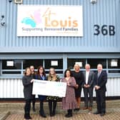 Julie Elliott MP presents the cheque to representatives from the charity.