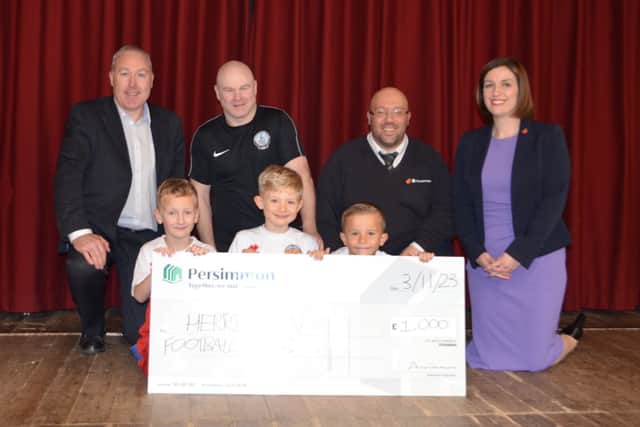 Bridget Phillipson MP with Herrington FC players and coaches at the cheque presentation.