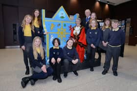 Sunderland City Council Mayor Cllr Dorothy Trueman and Consort Cllr Harry Trueman, with pupils from Fulwell Junior School and their King's Coronation seat at City Hall.