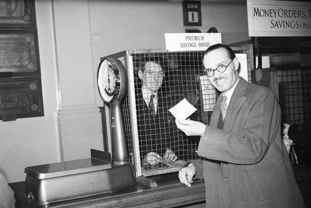 Mr C Fetrich buying a Premium Bond in 1956.