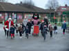 Watch as SAFC's Samson the cat joins children for Santa dash to collect food for Sunderland Food Bank