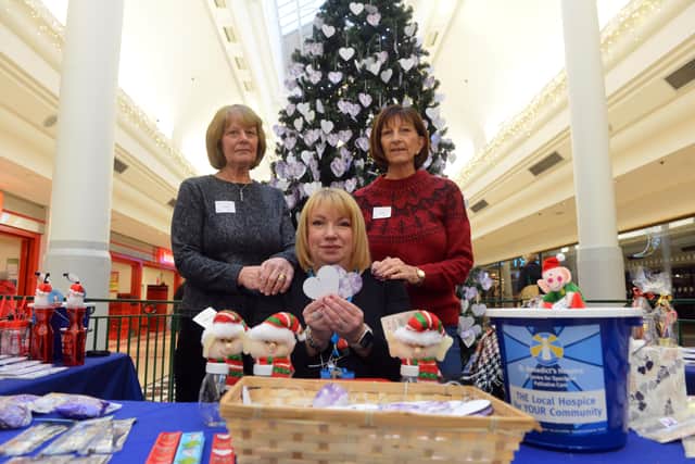 St Benedict's dedication Christmas tree in The Bridges with head of retail and fundraising Sheelagh Taylor with volunteers Valerie Coombs and Eileen Flatz.