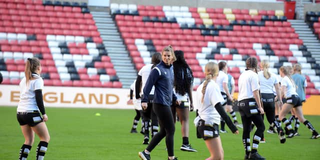 Sarah Hunter joins in a session with girls from Houghton Rugby Club at the Stadium of Light.