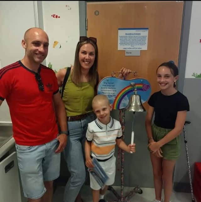 Gray and his family on the day he rang the bell to end his cancer treatment.