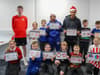 SAFC stars Mason Burstow and Jewison Bennette get creative with children at the Beacon of Light