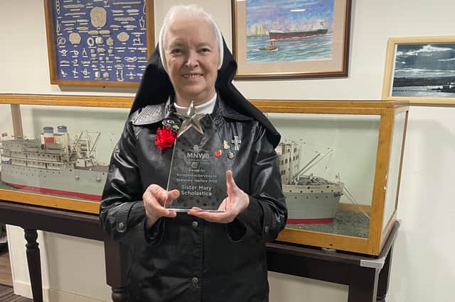 Sister Mary Scholastica with her award