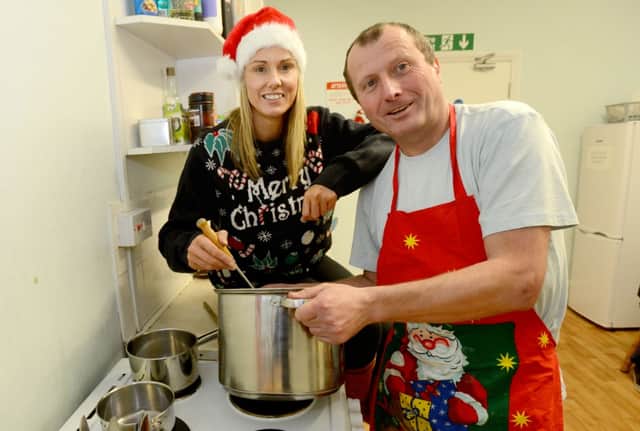 Project Manager Michele Anderson and David Smith project support worker making Christmas dinner in 2014.
