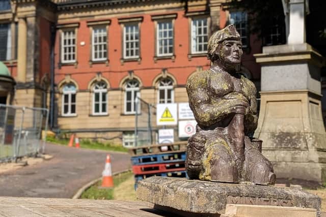 The miners statues which had to be temporarily removed from the front of Redhills during the restoration.