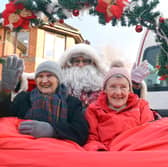 Paddock Stile Manor Dementia Care Home residents Effie Fannon and Heather Marsden get a free rickshaw ride from Santa