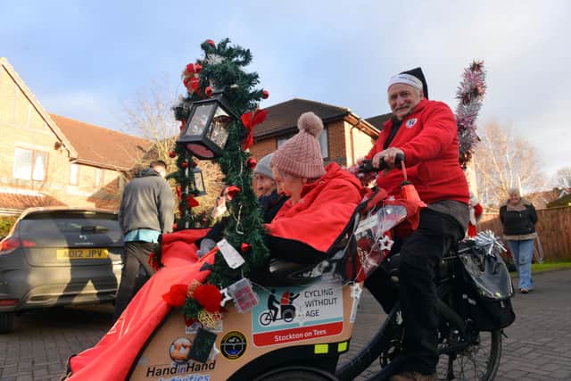 Paddock Stile Manor Dementia Care Home residents Effie Fannon and Heather Marsden get a free rickshaw ride from Cycling Without Age's Robert Watson.