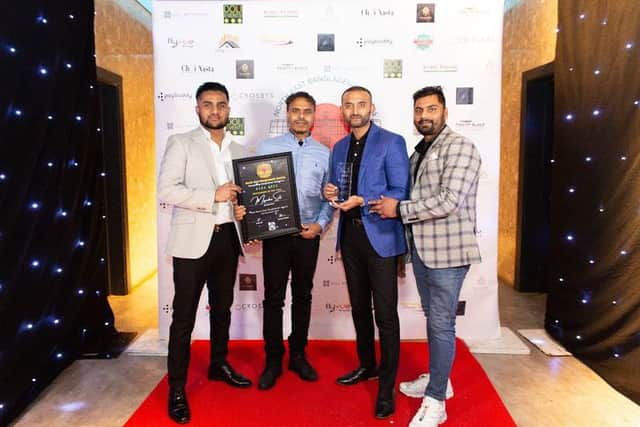 Owner Tahim Ahmed, blue jacket, with the team at the NEBA awards