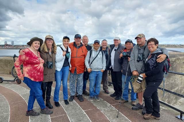 Ghislaine Pronk (second left) with fellow dolphin-spotters who were featured in a report with BBC weatherman Paul Mooney (fourth right) in July 2022