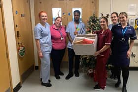 Members of DDOT drop off wrapped up nightwear ready to gift to patients on Ward E56 at Sunderland Royal Hospital.