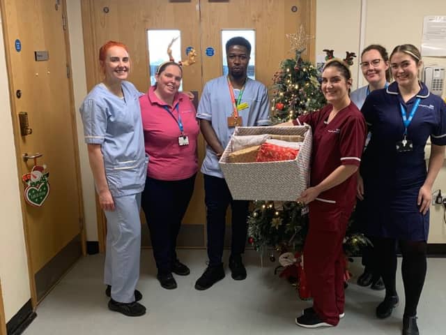 Members of DDOT drop off wrapped up nightwear ready to gift to patients on Ward E56 at Sunderland Royal Hospital.