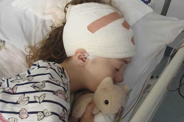 Catrina in hospital following major brain surgery.