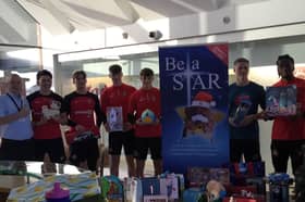 Salvation Army Community Manager Graham Wharton joins SAFC stars Luke O'Nien, Dennis Cirkin and Pierre Ekwah to collect donations at the Academy of Light.