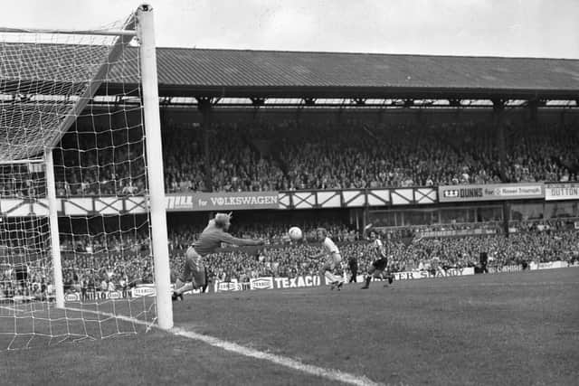 Action from the 1974 match at Roker Park with Bobby Kerr on the attack.