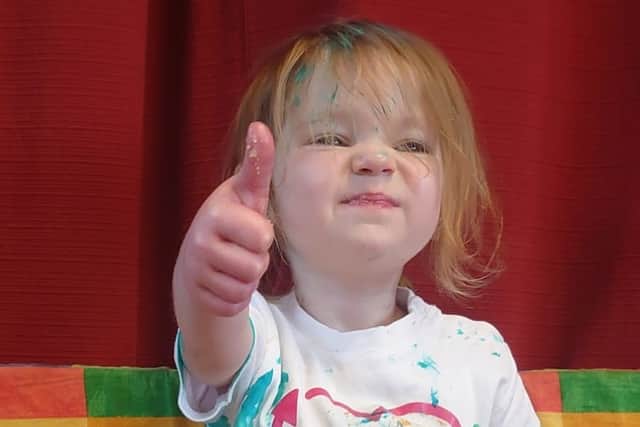 A thumbs-up from Beatrix at her birthday party.
