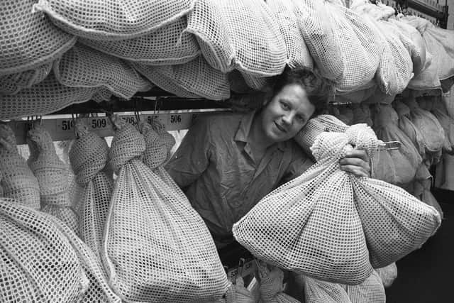 Tom Hall with bags of the new pit gear which was supplied under the workwear scheme at Vane Tempest Colliery, in 1979.