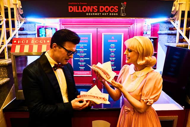 The cast of The Rocky Horror Show checking out the new Dillon's Dogs gourmet hot dogs at the Empire
