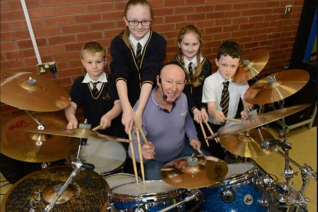 Former Satus Quo drummer Jeff Rich during his drumming workshop at Bernard Gilpin Prmary School.
He was pictured with l-r Nathan Griffith, Abigail Broadbent-Siddons, Amber Pearce and Oliver Bailey.