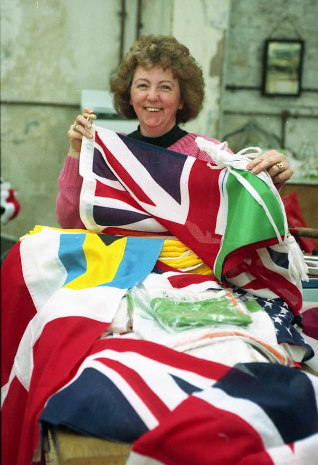 Pamela Atkinson with some of the flags at Speedings, in Whickham Street.