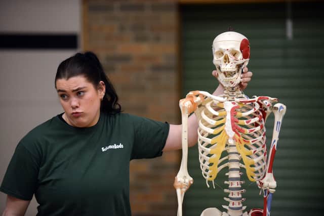 Performing Arts student Lucy Bibby using the skeleton prop.